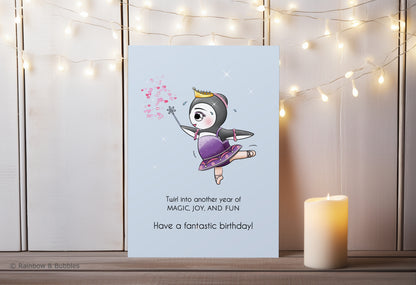 A kawaii birthday card from Rainbow & Bubbles, showing a ballerina penguin dancing and sprinkling magical fairy dust.