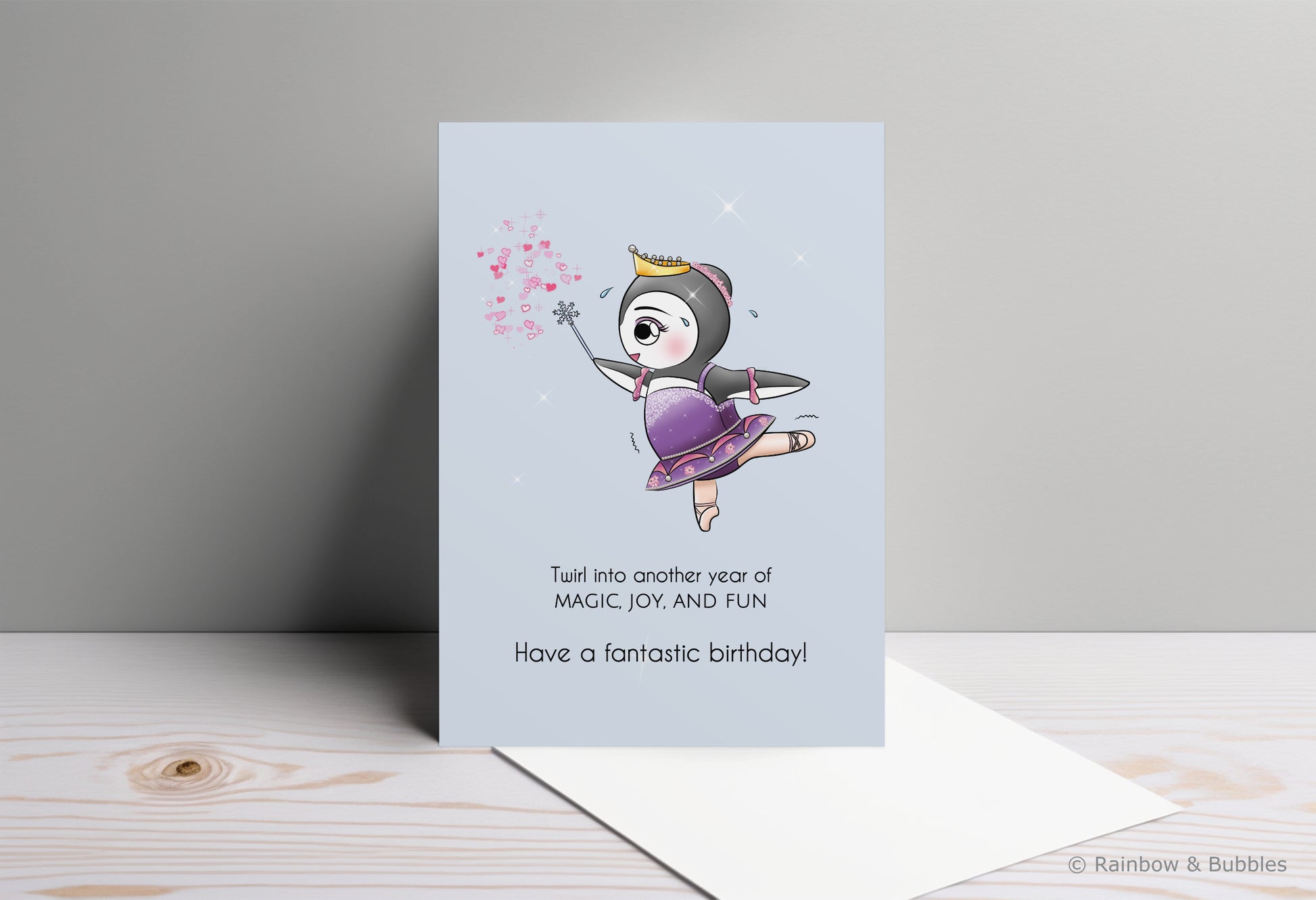 A kawaii birthday card from Rainbow & Bubbles, showing a ballerina penguin dancing and sprinkling magical fairy dust.