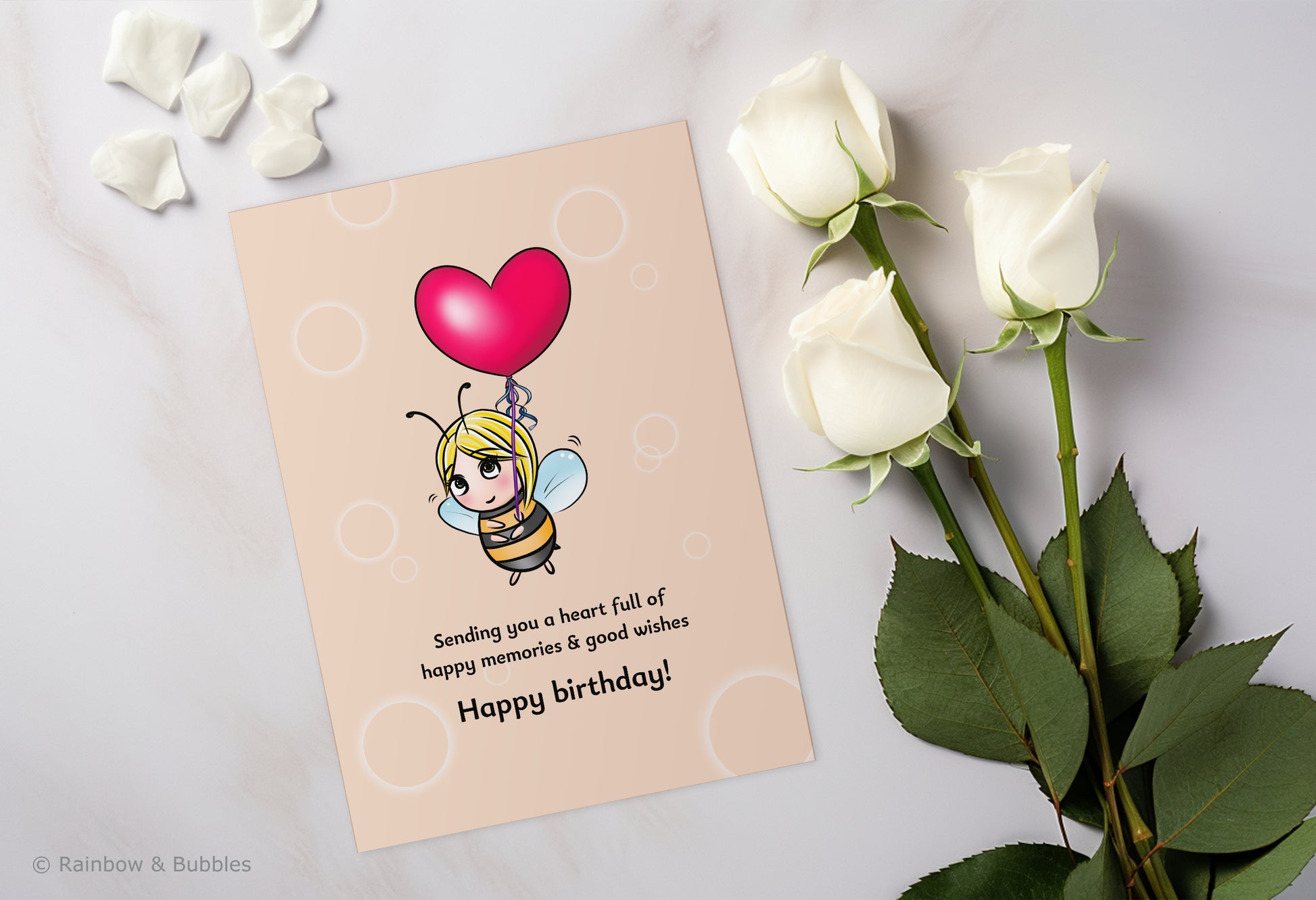 A kawaii birthday card from Rainbow & Bubbles, showing a bee holding a heart balloon.