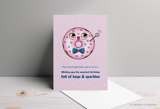 A kawaii birthday card from Rainbow & Bubbles, showing a kawaii glazed donut with a fancy bowtie waving at you.