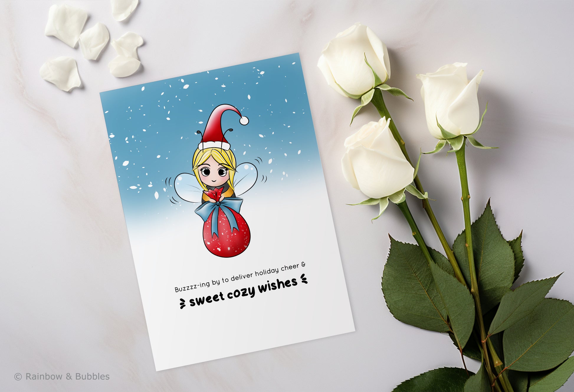 A kawaii greeting card from Rainbow & Bubbles, showing a bee with a santa hat delivering a big pretty bag of gifts.