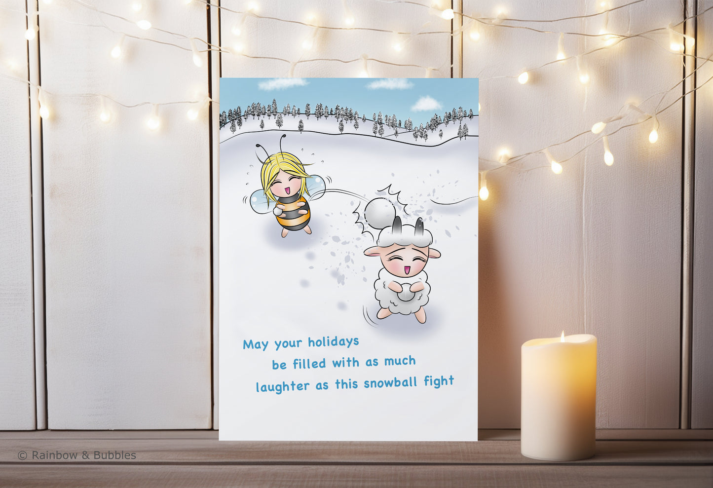 A kawaii greeting card from Rainbow & Bubbles, showing a bee and a sheep having a fun snowball fight.